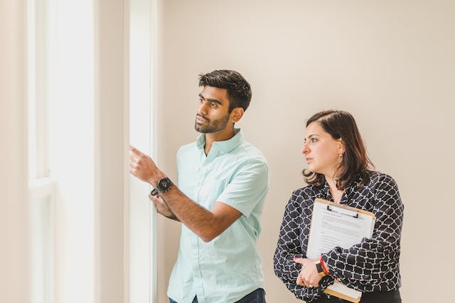 two-people-inspecting-property