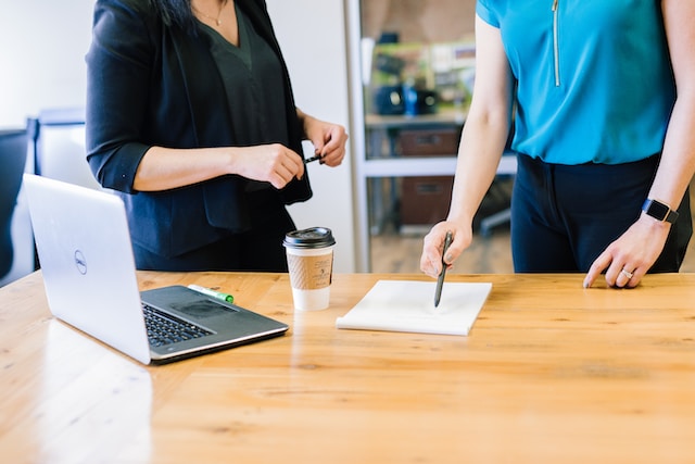 Two people discussing a contract.