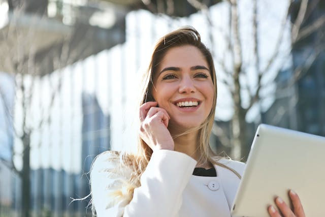 A person on the phone smiling