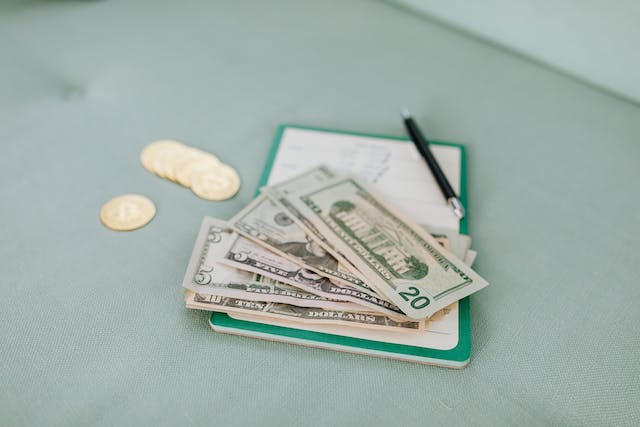 Some American money on a clipboard.