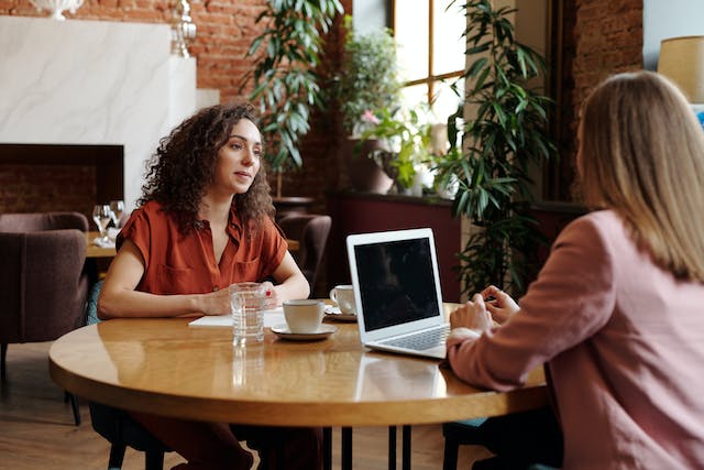 Two people in an interview.